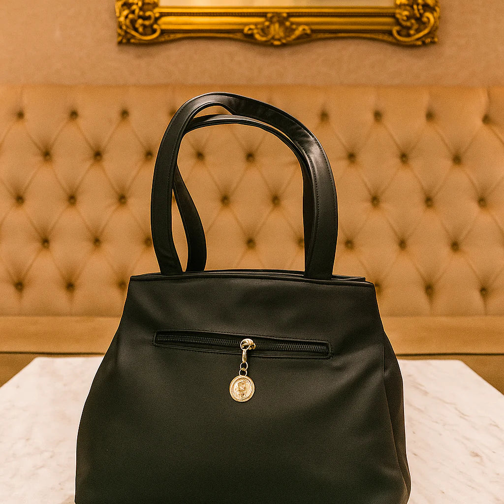 Elegant Black Leather Handbag with Gold Detailing